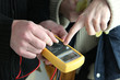 electricians using tester