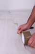 Man taping the floor