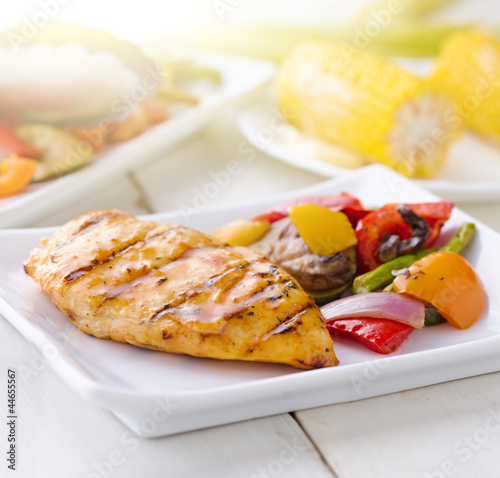 Photo: summertime barbecue chicken with vegetables. summertime barbecue chicken with vegetables.