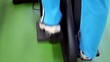 Womans foot in sport shoes moves on step training equipment