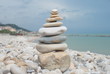 Stacked tower of rocks on stoned coast