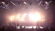 Lot of people in hall on fighting event, girls dance on stage
