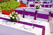outdoor tables with served plate and wine glasses