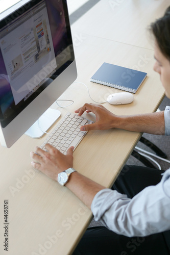 Photo: Man working at a computer Man working at a computer