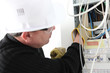 Electrician repairing electric meter