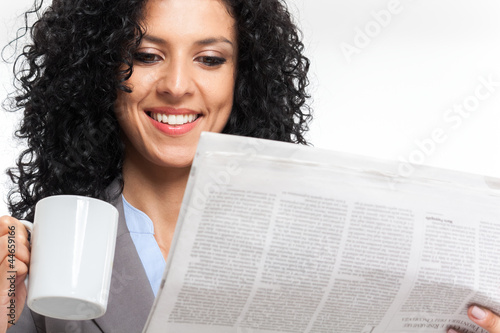 Photo: Woman reading newspaper Woman reading newspaper