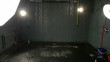 Waterfall in room with two spotlights on both side