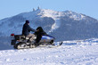 Man riding on the snowmobile.