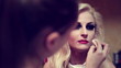 Professional visagiste applying makeup to a model