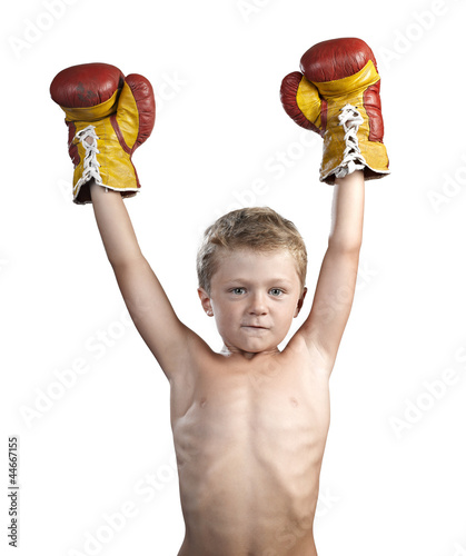 Photo: cute little boy with boxing gloves isolated on white cute little boy with boxing gloves isolated on white