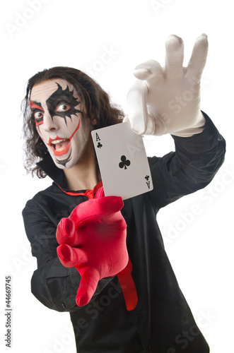 Photo: Joker with cards isolated on white Joker with cards isolated on white