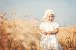 Laughing kid in sunny wheat  field