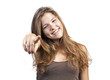 Happy woman with hand pointing at you - isolated over a white ba