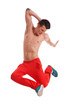 shirtless young dancer jumping