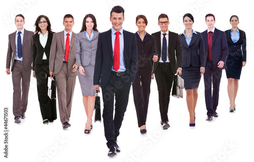 Photo: Successful happy business team walking Successful happy business team walking