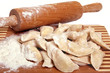 Raw Dumplings on cutting board on wooden background close-up