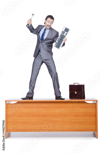 Photo: Businessman breaking his computer Businessman breaking his computer