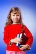 Little girl with books on white