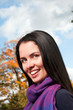 Portrait of young beautiful woman in the park
