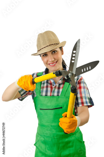 Photo: Girl with garden scissors on white Girl with garden scissors on white