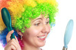Woman with hairbrush and mirror