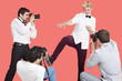 Paparazzi taking photographs of male actor over red background