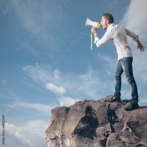 Photo: Boy screaming on the megaphone Boy screaming on the megaphone