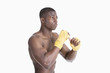 Photo: Shirtless African American kickboxer over gray background Shirtless African American kickboxer over gray background