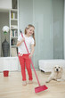 Girl sweeping the floor 