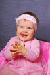 happy baby girl in pink dress