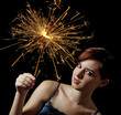 Photo: young girl with a sparkler young girl with a sparkler