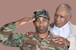 Foto: Portrait of US Marine Corps soldier with father saluting over brown background Portrait of US Marine Corps soldier with father saluting over brown background
