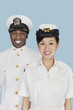 Foto: Portrait of multi-ethnic US Navy officers smiling over light blue background Portrait of multi-ethnic US Navy officers smiling over light blue background