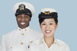 Foto: Portrait of multi-ethnic US Navy officers smiling over light blue background Portrait of multi-ethnic US Navy officers smiling over light blue background