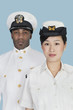 Portrait of two US Navy officers over light blue background