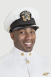 Foto: Portrait of a happy young African American US Navy officer over gray background Portrait of a happy young African American US Navy officer over gray background