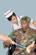 Photo: Nurse with US Marine Corps soldier holding artificial limb as he sits in wheelchair over light blue background Nurse with US Marine Corps soldier holding artificial limb as he sits in wheelchair over light blue background