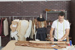 Mature male fashion designer working in design studio