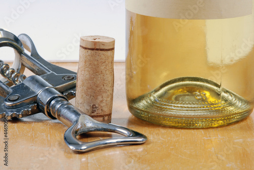 Photo: wine bottle with cork and corkscrew wine bottle with cork and corkscrew
