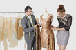 Fashion designers working together on an outfit in design studio