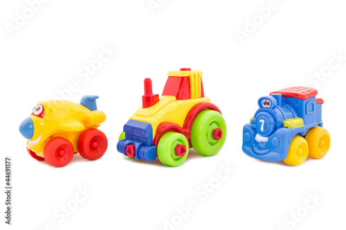Photo: Set from three plastic toys - the plane, a tractor and a steam l Set from three plastic toys - the plane, a tractor and a steam l