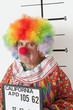 Foto: Portrait of angry senior clown during mug shot Portrait of angry senior clown during mug shot