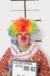 Foto: Portrait of senior clown posing for mug shot Portrait of senior clown posing for mug shot