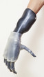Photo: Close-up of man's prosthetic hand over gray background Close-up of man's prosthetic hand over gray background