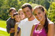 Teens smiling in the park campus students