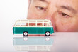 Man looks on model buses