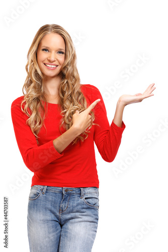 Photo: portrait of a beautiful blond lady pointing her finger towards b portrait of a beautiful blond lady pointing her finger towards b
