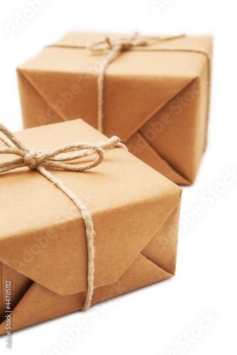 Photo: Parcel wrapped with brown paper tied with rope Parcel wrapped with brown paper tied with rope