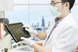 Photo: Dentist with computer tablet Dentist with computer tablet