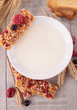 bowl of milk with granola and berries fruit